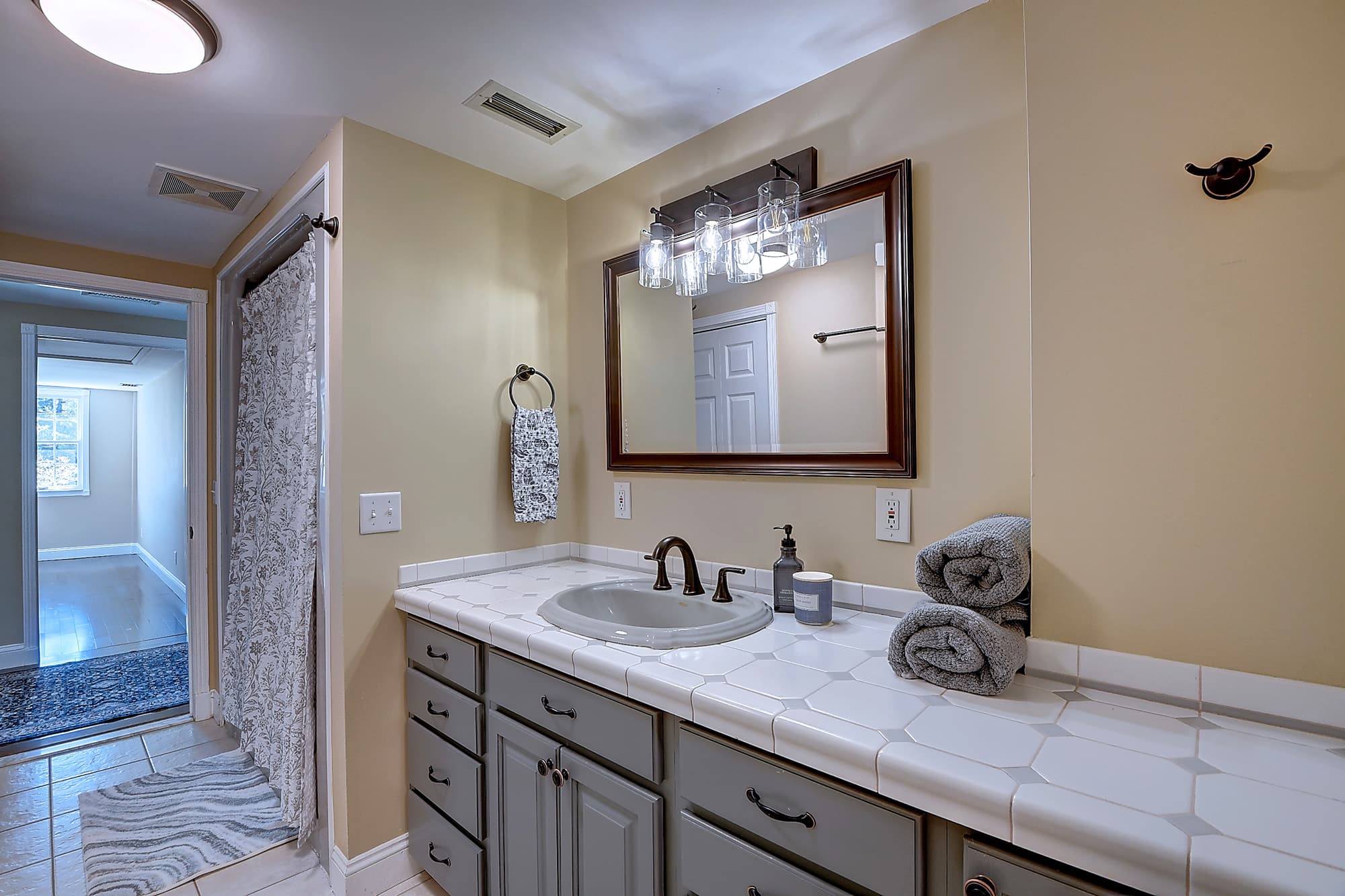 Full bathroom with custom tile vanity