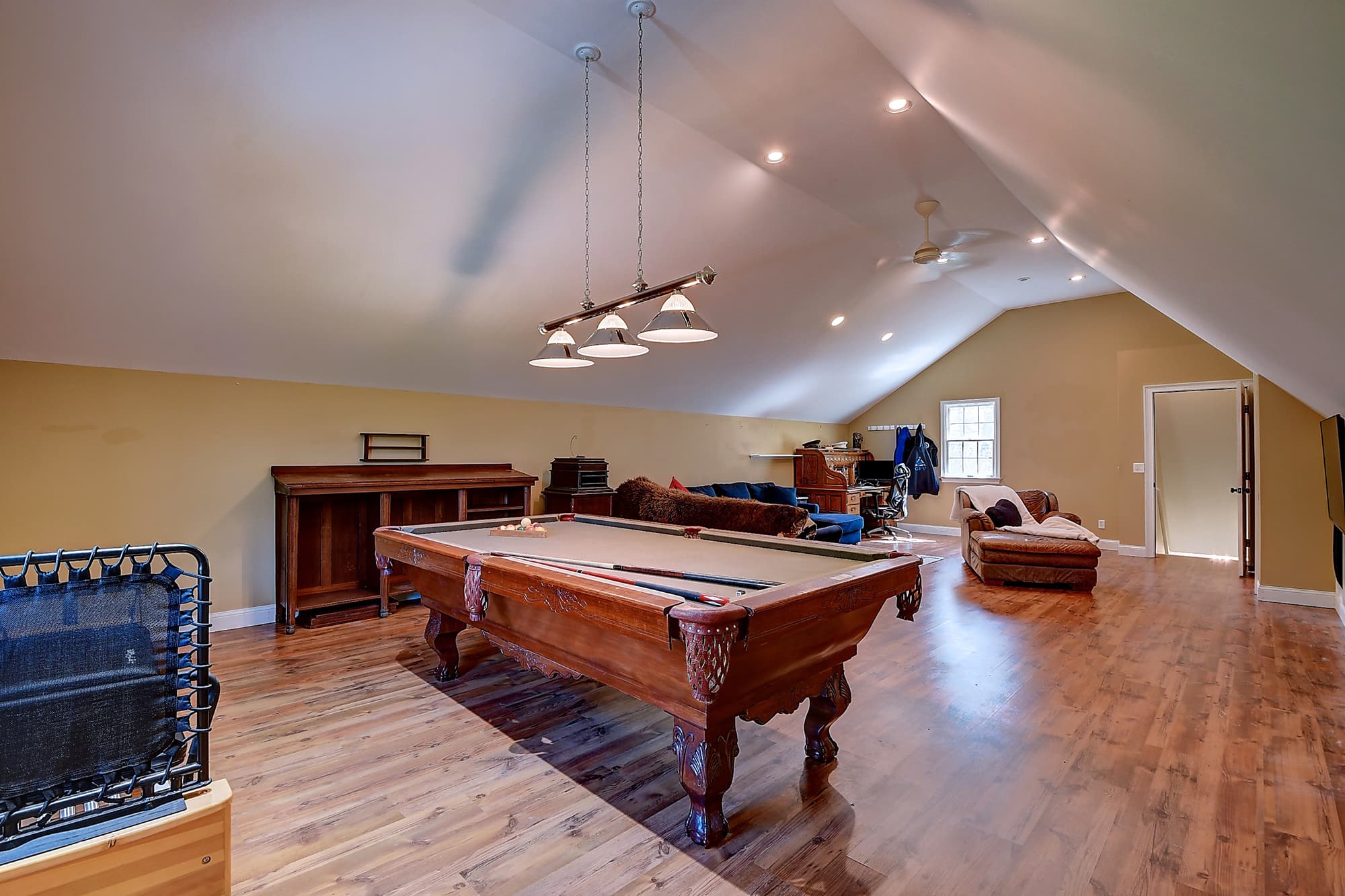 38 by 16 foot upper great room with vaulted ceiling and built-ins